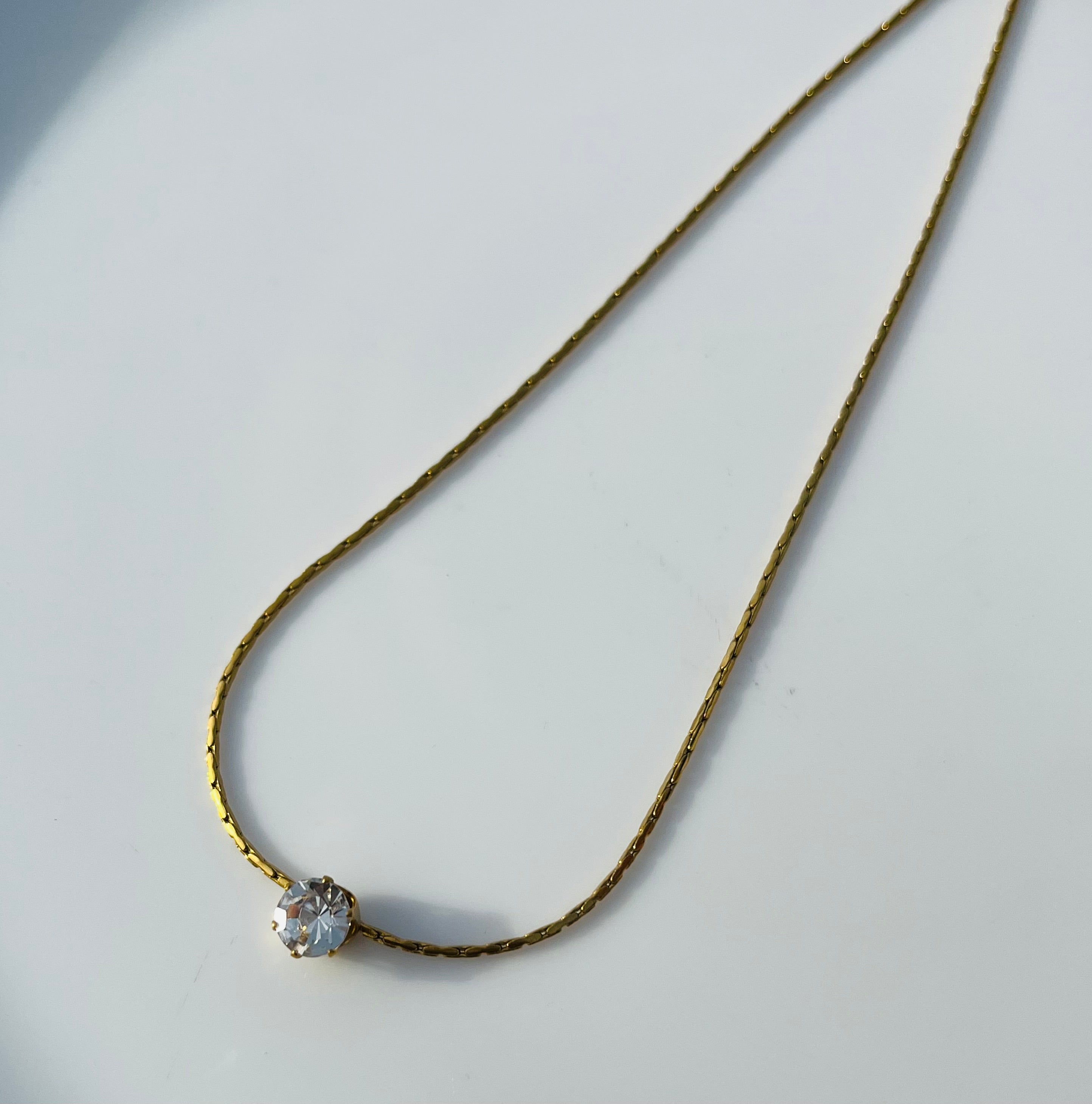 Dainty white stone pendent