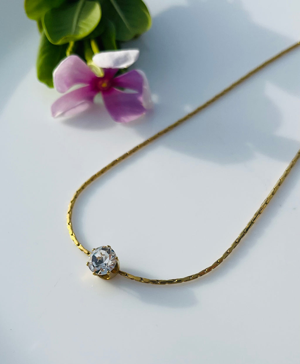Dainty white stone pendent